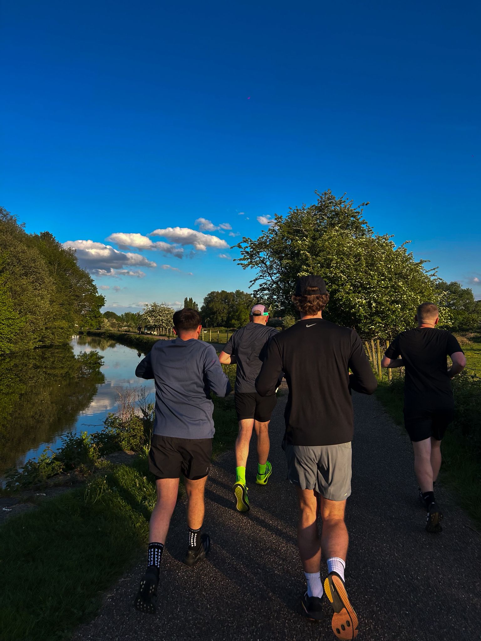 Spire collective canal-side group run at golden hour