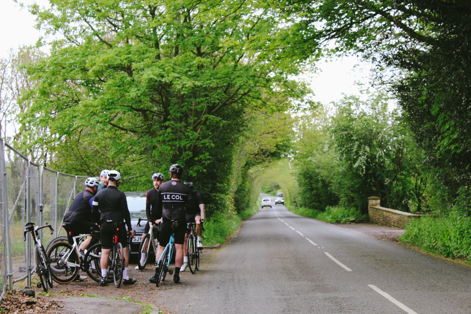 Spire riders regrouping on a tree-lined Lancashire lane